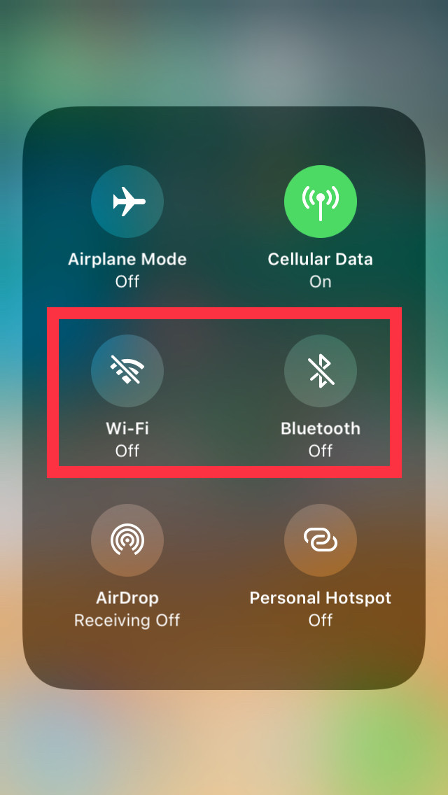 Disable Unnecessary Wireless Features for Energy Savings – UpgradeByUs An UpgradeByUs visual guide showing the iPhone Control Center with Wi-Fi and Bluetooth toggles highlighted in red to signify disabling them